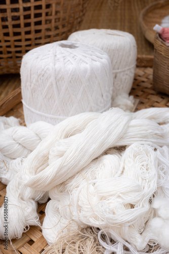 Close focus on white cotton yarn prepared for sewing.