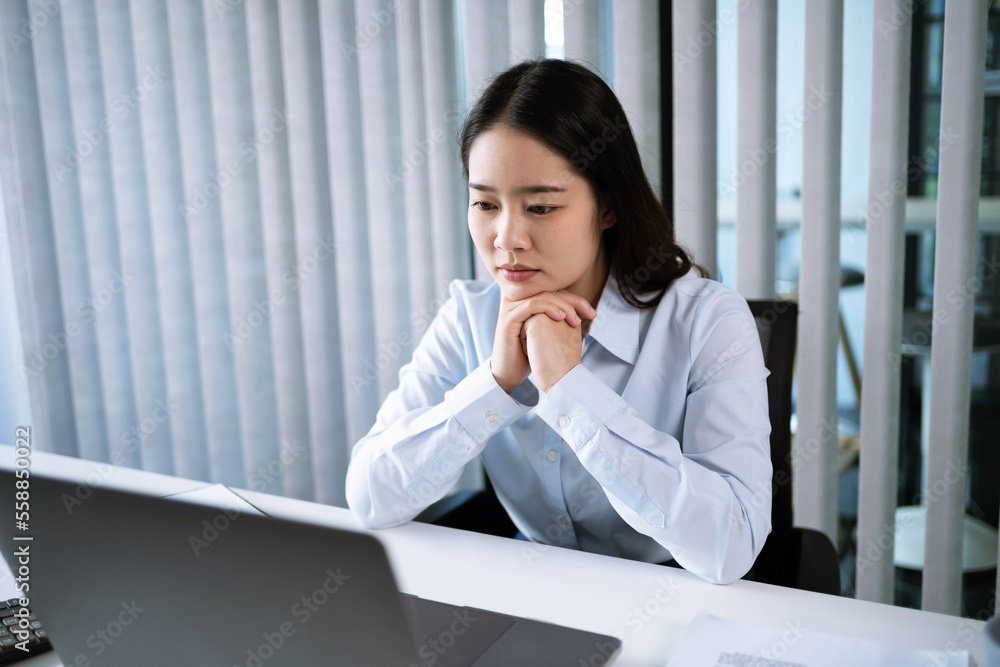 Portrait of Asian Business woman boring job. routine employees Bored executive sitting in office with office Portrait of Asian Business woman boring job. routine employees Bored executive sitting in office with office