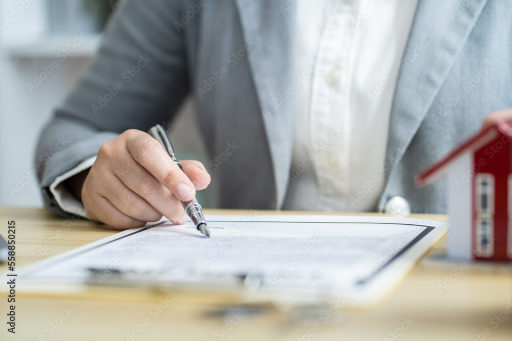 Business people signing contract making deal with real estate agent Concept for consultant home insurance.Real estate investment Property insurance security. Real estate agent offer house Business people signing contract making deal with real estate agent Concept for consultant home insurance.Real estate investment Property insurance security. Real estate agent offer house