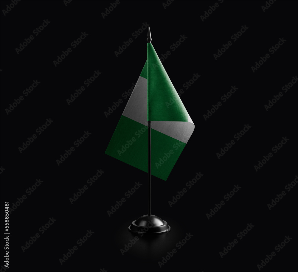 Small national flag of the Nigeria on a black background
