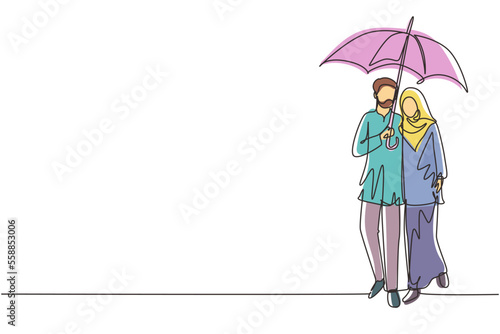 Single continuous line drawing Arabian couple man woman, girl and boy walking holding umbrella under rain smiling hugging. Romantic couple at rainy autumn weather. One line draw graphic design vector