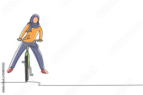 Single one line drawing happy Arabian woman in casual clothes riding bicycle. Healthy and sport lifestyle. Ecological vehicle of transportation. Continuous line draw design graphic vector illustration