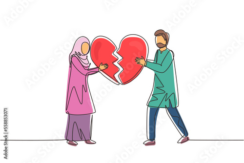 Single one line drawing heartbroken Arabic couple parting, divorce. Sad young man and woman trying to put together parts of broken heart. Modern continuous line draw design graphic vector illustration