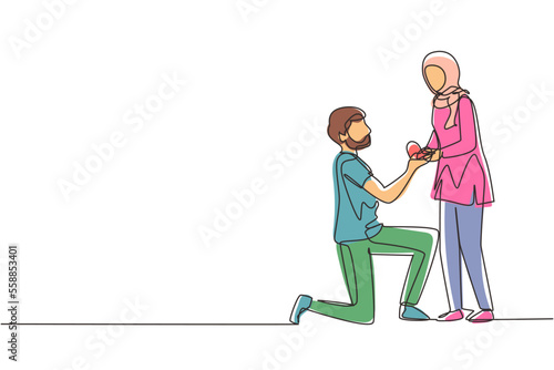 Continuous one line drawing Arabian man kneeling holding engagement ring proposing woman marry him happy marriage wedding. Guy on knees proposing girl to marry. Single line draw design vector graphic