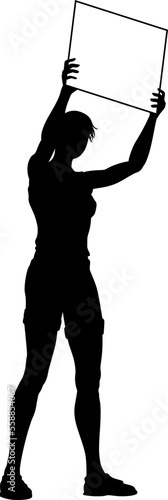 Protestor or demonstrator at a demonstration march, picket line or strike protest rally in silhouette. Holding up a banner or picket sign board placard.