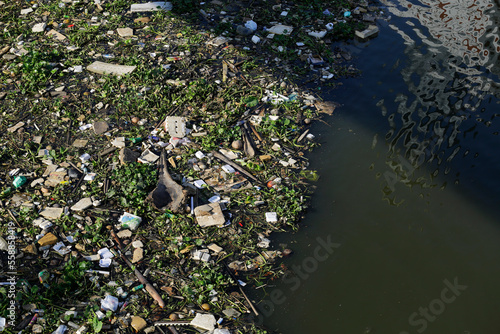 Aerial view of trash polluting the Saigon river, downtown Ho Chi Minh City, Vietnam.