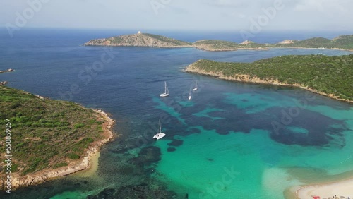 Turquoise blue bay with boats, islands and Tuerredda beach in Teulada, Sardinia, Italy - 4k Aerial photo