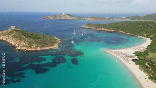 Turquoise blue bay, Tuerredda beach, boats and islands in Teulada, Sardinia, Italy - 4k Aerial photo