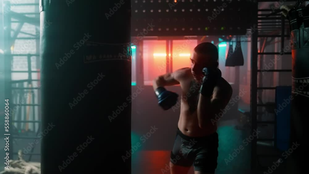 MMA fighters enter the cage ring. Mixed martial arts fight. Cinematic staged fight. Boxing in a ring or cage. Two fighters fight for the right to be the champion. MMA fighters enter the cage ring. Mixed martial arts fight. Cinematic staged fight. Boxing in a ring or cage. Two fighters fight for the right to be the champion.