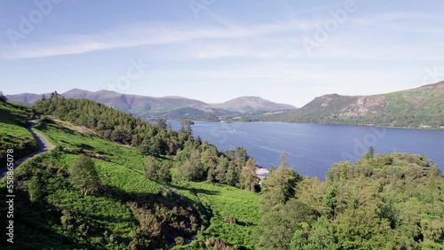 Drone shot flying towards Derwent Water on a sunny day, Lake District, Cumbria, UK photo