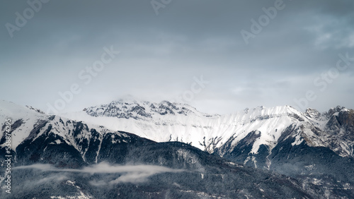 Mountain landscape. Cold mountain. Alps at sunset. Towering blue cloud.Glacier in the mountains.Panorama on top of a snowy mountain near Saint Jean de Maurienne. Saint Jean de Maurienne in the French  © TMC