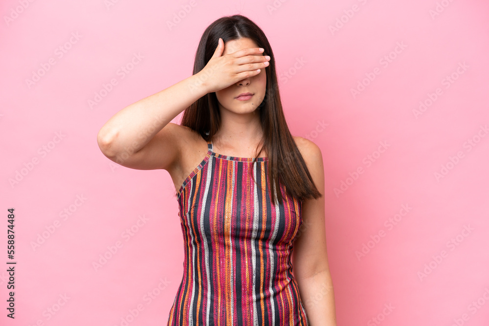 Young Brazilian woman isolated on pink background covering eyes by hands. Do not want to see something Young Brazilian woman isolated on pink background covering eyes by hands. Do not want to see something