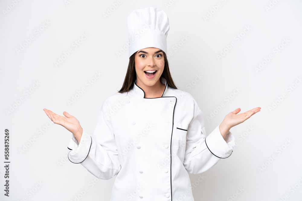 Young Brazilian chef woman isolated on white background with shocked facial expression Young Brazilian chef woman isolated on white background with shocked facial expression