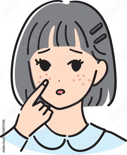 頬のニキビに悩む女の子