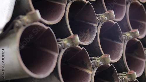 The old Soviet BM-21 Grad multiple launch rocket system on the chassis of a 375D truck. MLRS 9K51 caliber 122 mm close-up, rear fragment. Artillery mount of 40 empty tubular rails.