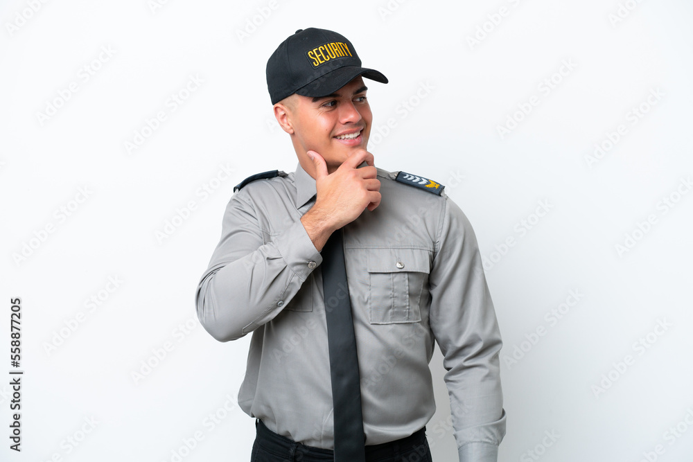 Young caucasian security man isolated on white background looking to the side Young caucasian security man isolated on white background looking to the side