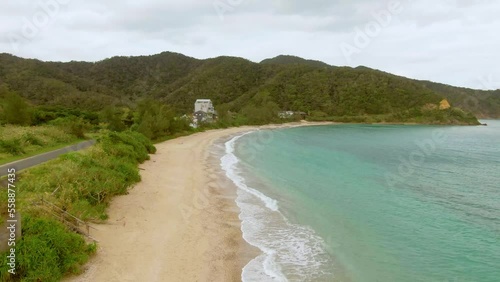 Drone flight along sandy coastline of tropical Amami Island, Japan photo