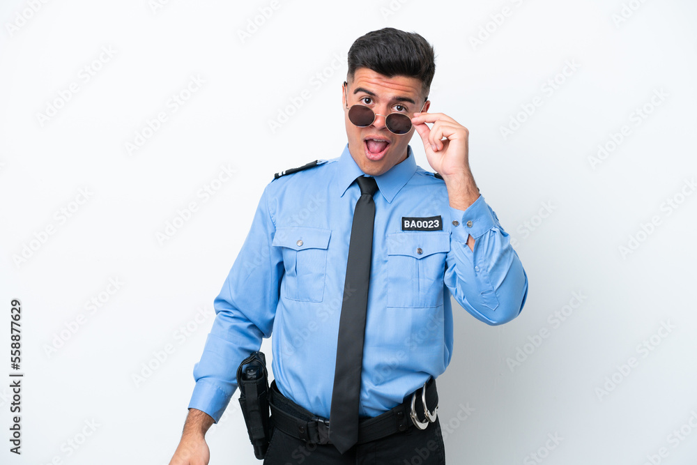 Young police caucasian man isolated on white background with glasses and surprised Young police caucasian man isolated on white background with glasses and surprised