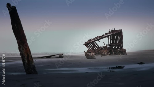 The shipwrecked Peter Iredale's rusting hull sticks up from the Clatsop Spit. photo