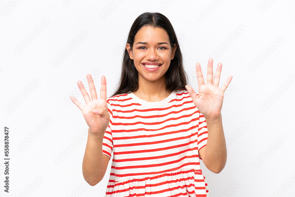 Young Colombian woman isolated on white background counting nine with fingers Young Colombian woman isolated on white background counting nine with fingers