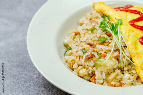 Omelet rice dish served on a white plate