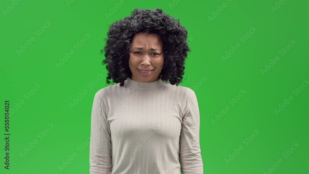 portrait woman pointing at something and laughing isolated on Green Screen portrait woman pointing at something and laughing isolated on Green Screen