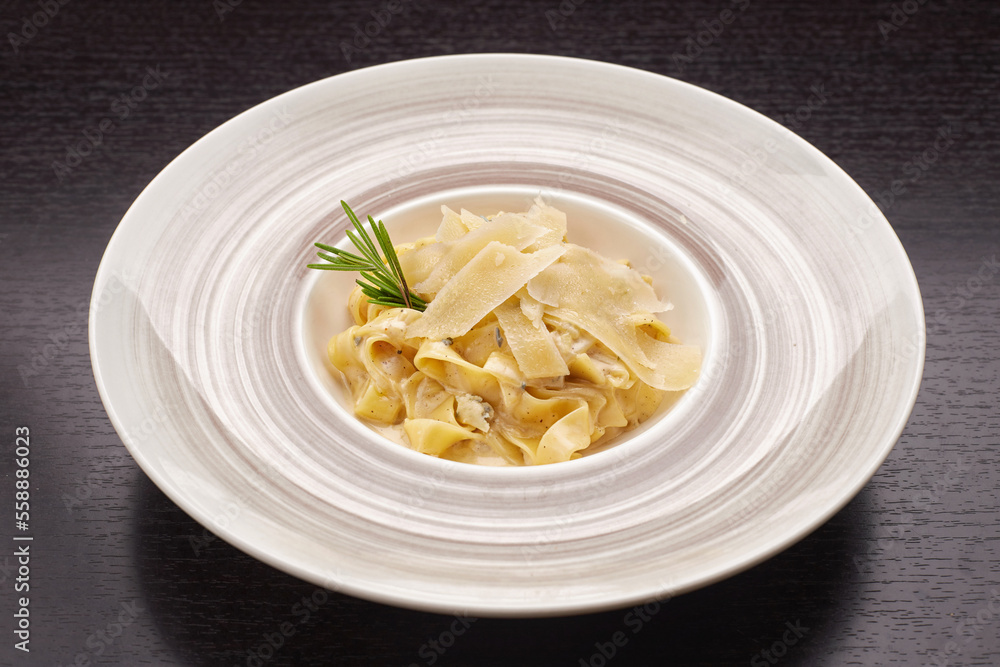 Pasta with cheese and sauce on a plate Pasta with cheese and sauce on a plate