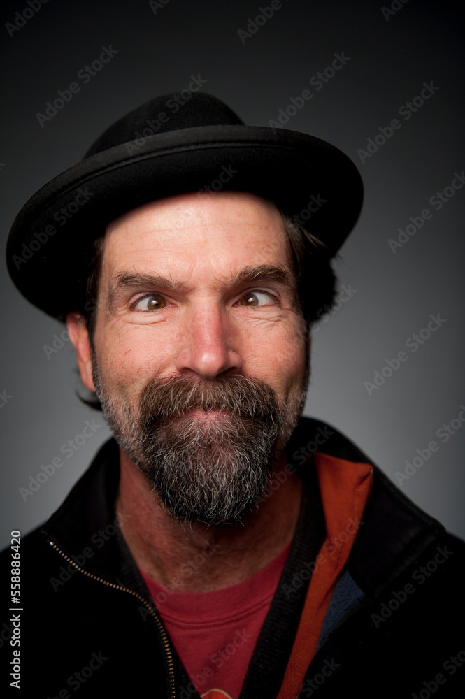 Closeup studio portrait of a mixed Caucasian / native american 52 years old man making goofy crossed eyes. Closeup studio portrait of a mixed Caucasian / native american 52 years old man making goofy crossed eyes.