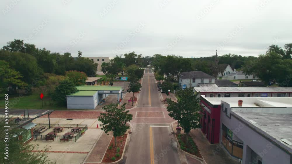 Reverse aerial flyover of the empty and abandoned downtown area of Ocoee, Florida with nobody and no vehicles. Ocoee is a family oriented town with restaurants, breweries, bars, and shopping. Reverse aerial flyover of the empty and abandoned downtown area of Ocoee, Florida with nobody and no vehicles. Ocoee is a family oriented town with restaurants, breweries, bars, and shopping.