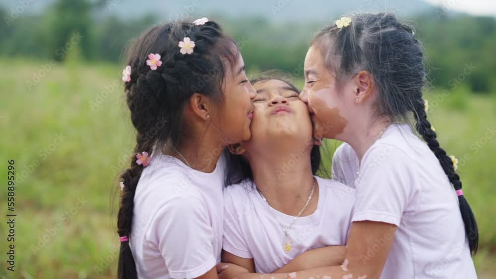 Three little cute child asia sisters kiss cheek cuddle hug look at camera smile fun having good time best friend. Diverse skin sibling Young people small kid girls love trust relax happy sweet moment. Three little cute child asia sisters kiss cheek cuddle hug look at camera smile fun having good time best friend. Diverse skin sibling Young people small kid girls love trust relax happy sweet moment.