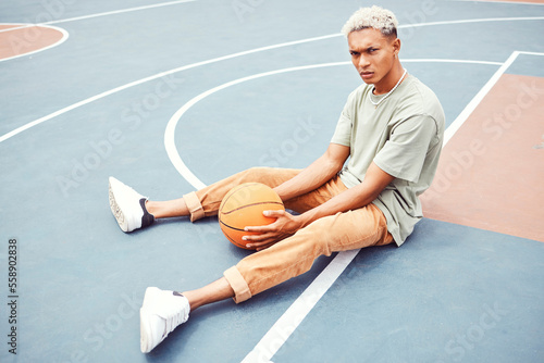 Fototapeta Naklejka Na Ścianę i Meble -  Black man, basketball court and portrait for fashion, sports or outdoor fitness in summer sunshine. Urban man, basketball player or sport for wellness, exercise or workout with edgy clothes in city