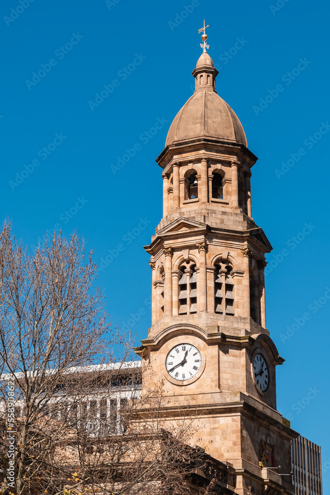 Fototapeta premium Adelaide City Town Hall with clock tower viewed from King William street on a day