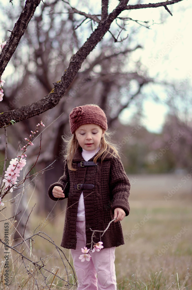 Portrait of a little girl with a branch of blossom Portrait of a little girl with a branch of blossom