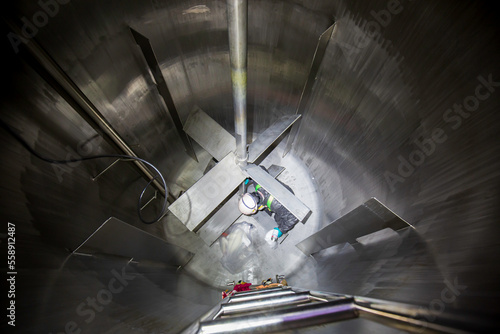 Fototapeta Naklejka Na Ścianę i Meble -  Male into work inspection process chemical into oil storage tank confined space