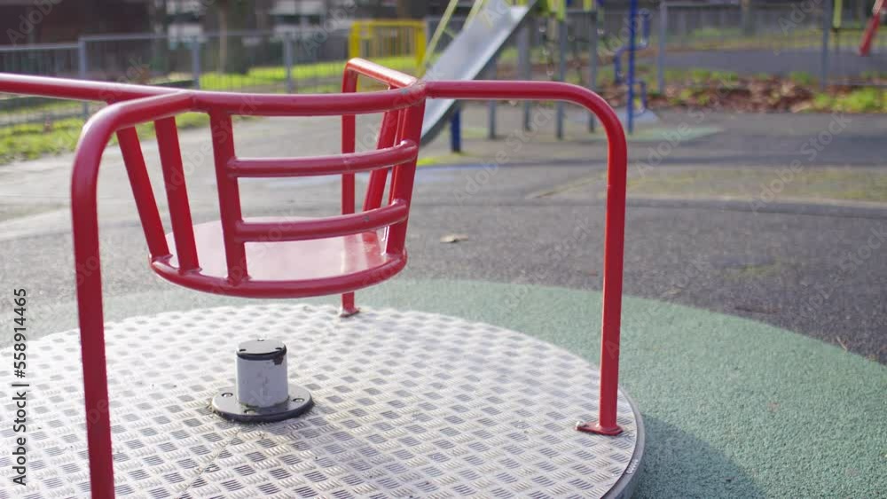 Camera moves across and empty abandoned playground with unused equipment on display Camera moves across and empty abandoned playground with unused equipment on display