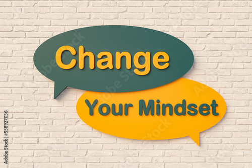 Change your mindest - Cartoon speech bubble. Cartoon speech bubble, text in yellow and dark green against a brick wall. Progress, improvement and new beginnings concept. 3D illustration photo