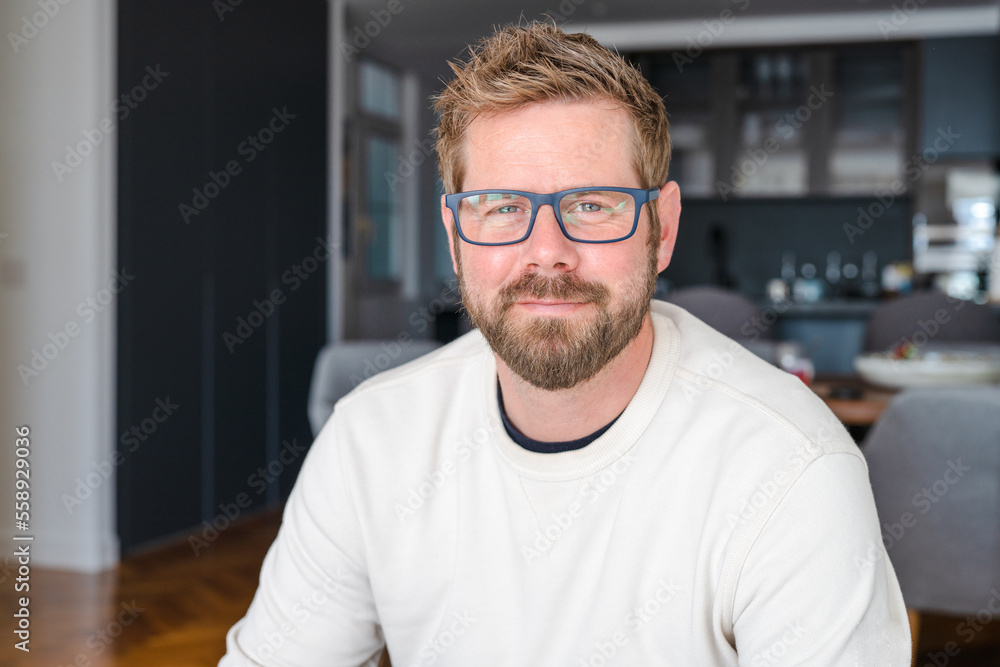 Young handsome man wearing glasses smiling at home. Young handsome man wearing glasses smiling at home.