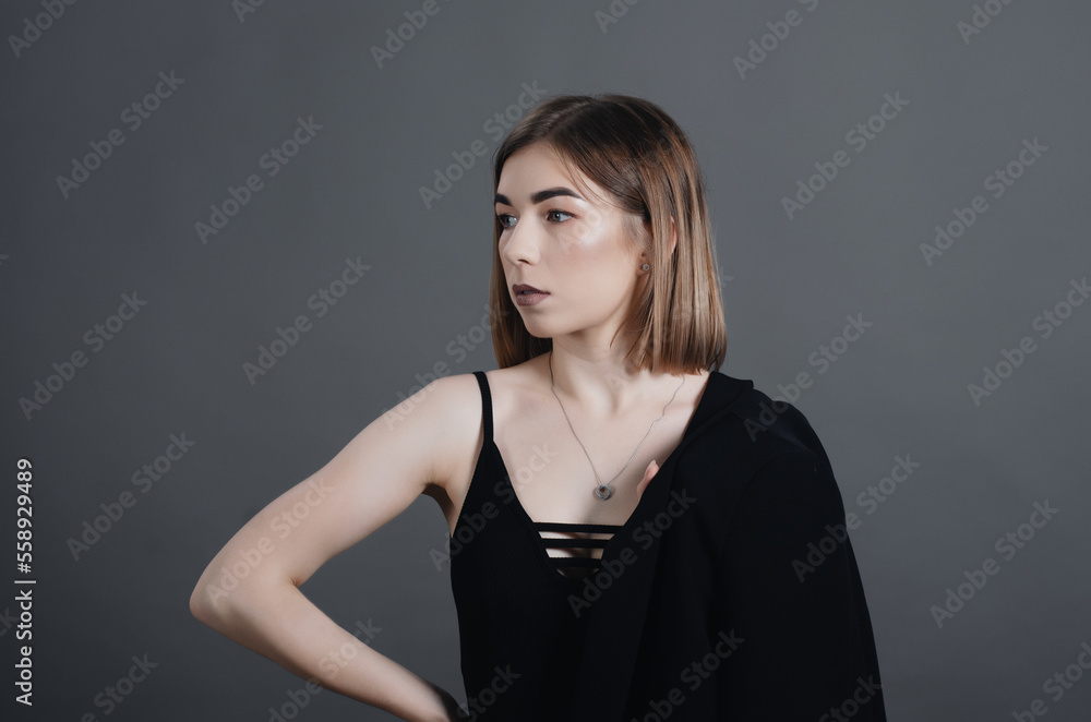 Naklejka premium Pretty girl, portrait in the studio, elbow to the side