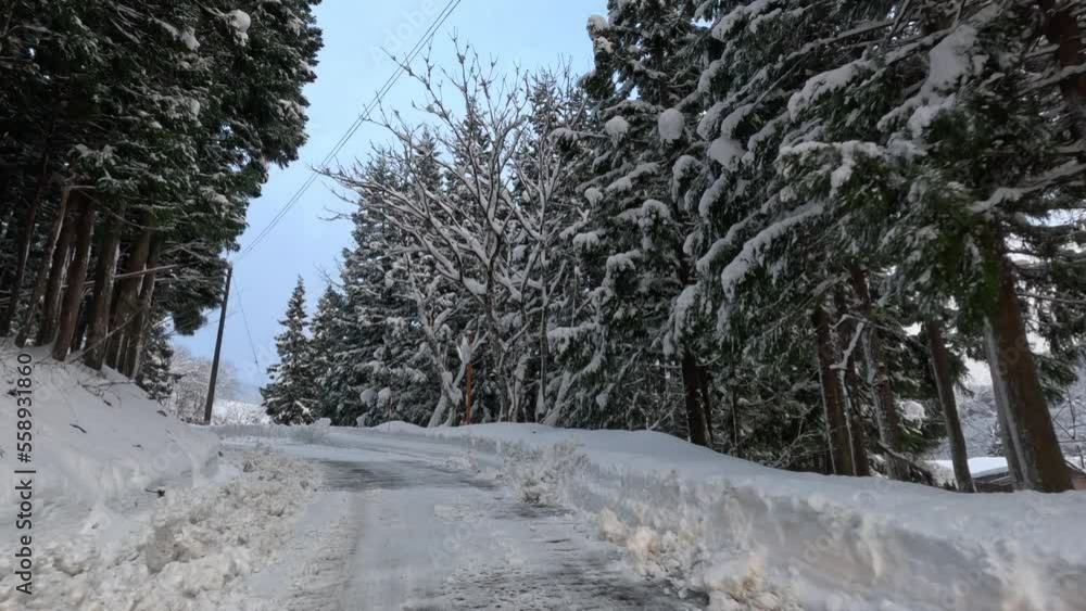 Diving through snow on narrow mountain road in winter landscape Diving through snow on narrow mountain road in winter landscape