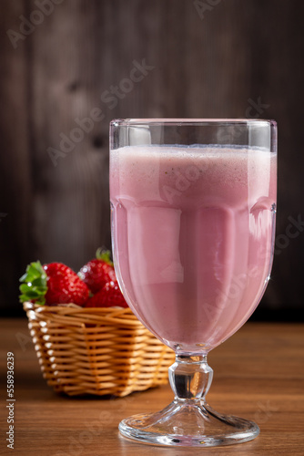 Glass with tasty strawberry smoothie.