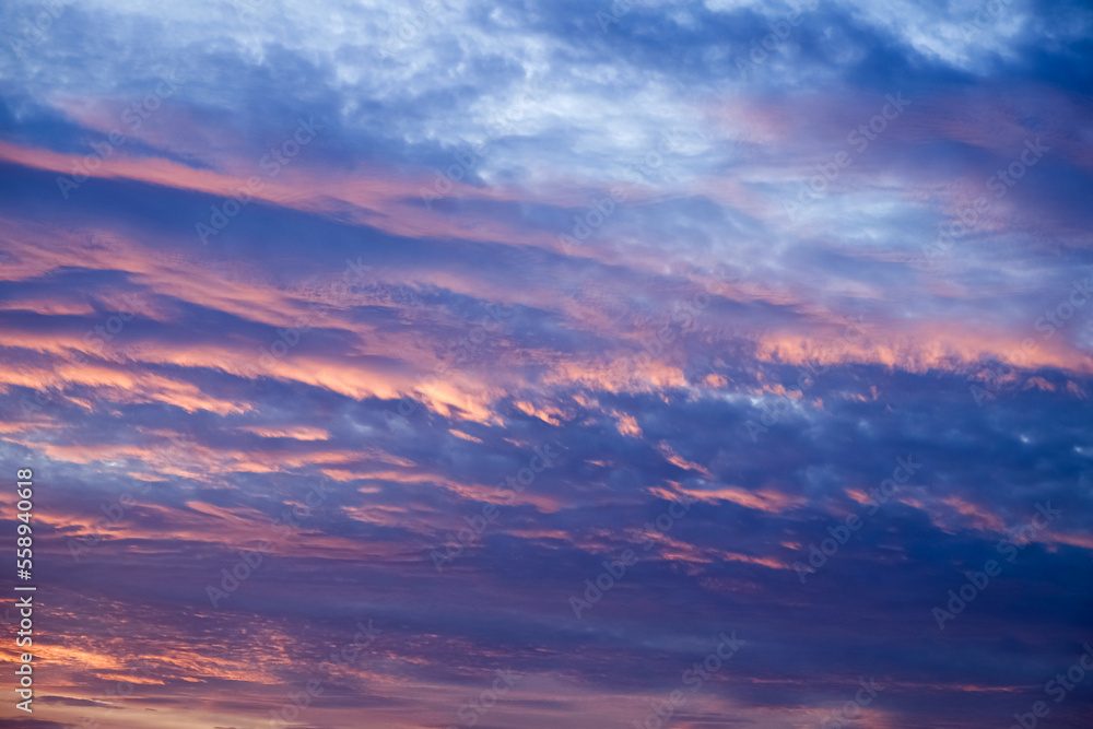 Obraz premium Coludy purple sunset sky photograph in winter season to be used as a background image and used to decorate graphics