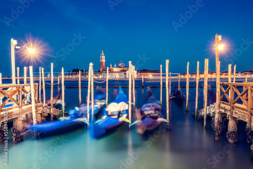 Gondolas in Venice, Italy at night.