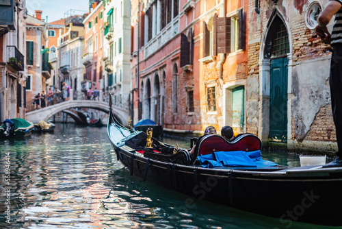 Gondola on canal in Venice, Italy.