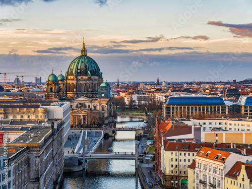 Aerial shot of Berlin Cathedral, Spree canal and historic buildings during asunset, Germany photo