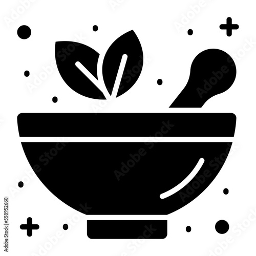 Mortar pestle with herbal leaves denoting herbal medicine