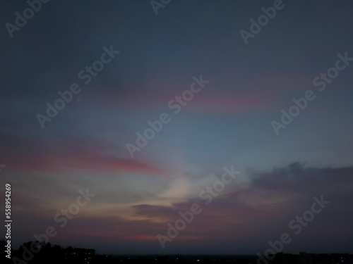 Sunset scenery view of colorful sky, nature photography, dramatic weather conditions, clouds background, natural wallpaper, rainbow over the city