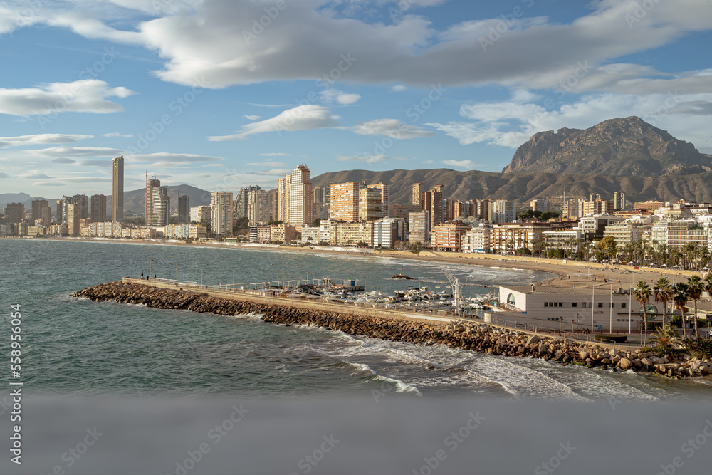 View of the skyline of the poniente beach from the balcony of the Mediterranean of Benidorm on the Costa Blanca, Alicante, Spain, in a windy winter day.