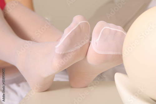 legs in white nylon socks