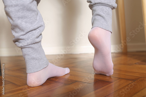 feet in white nylon socks