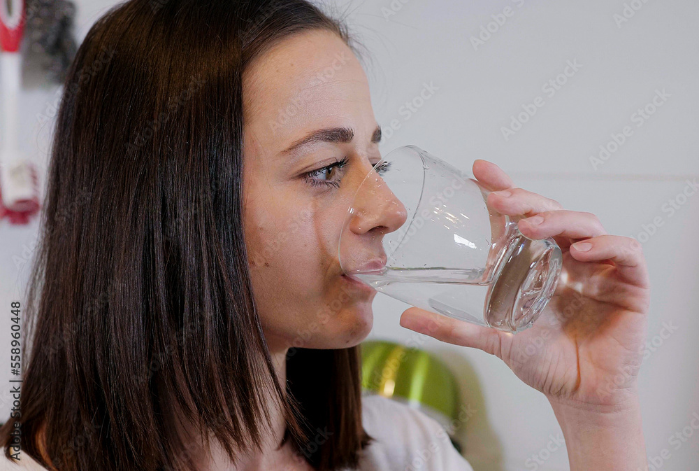 Close up shot drinking clear water - home shooting Close up shot drinking clear water - home shooting
